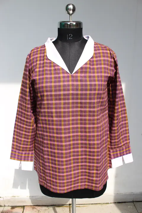 Client photo: Sabki Madras shirt on a black dress form, whole front view, against a grey wall.