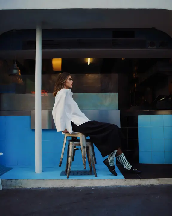 ZOYA outside a night cafe
